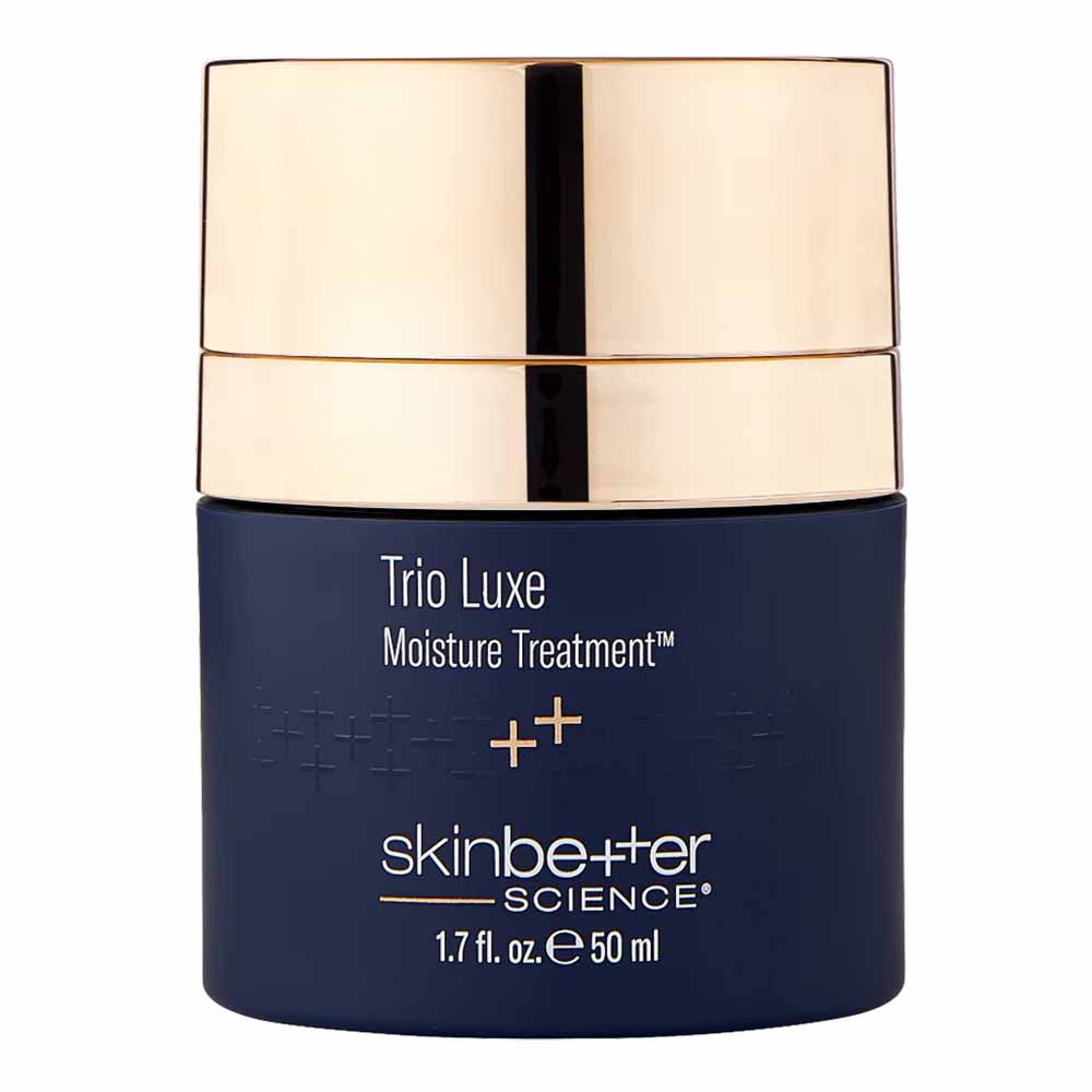 Blue skincare jar with gold lid labeled 'Trio Luxe Moisture Treatment' by skinbetter science